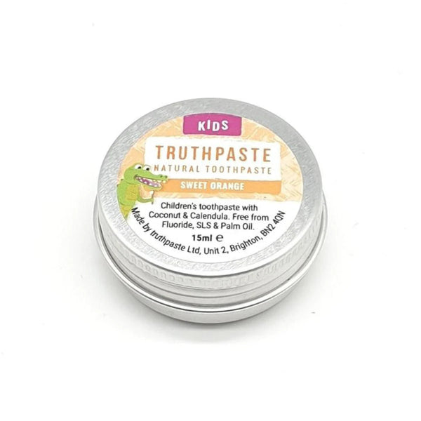 Children’s Truthpaste by Truthpaste in a 15ml tin, featuring a zero-waste design and Sweet Orange flavor; contains coconut, calendula, and xylitol; available at Fisa Health.